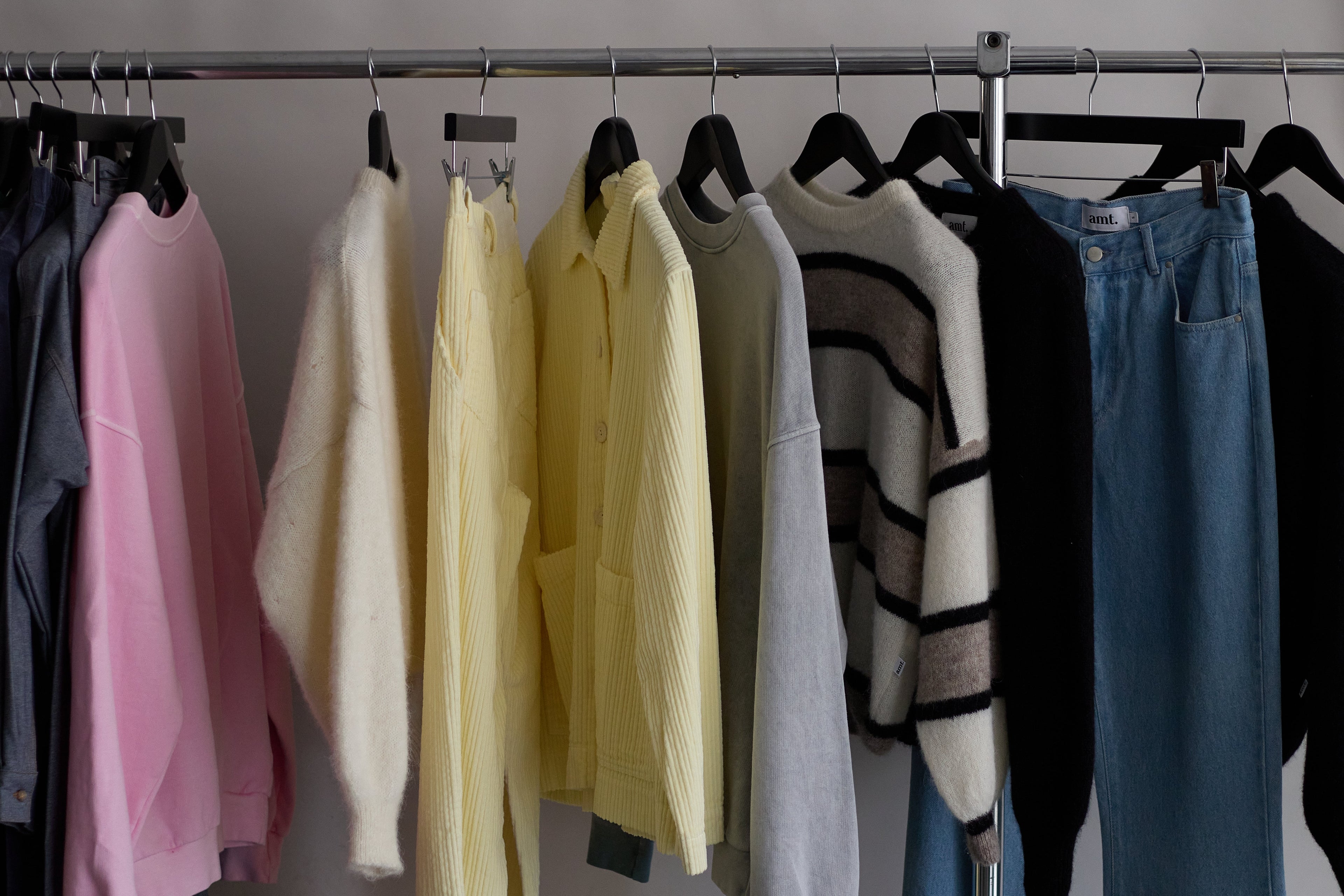 amt. studio SS26 — garments hanging on a clothes rack, summer capsule wardrobe