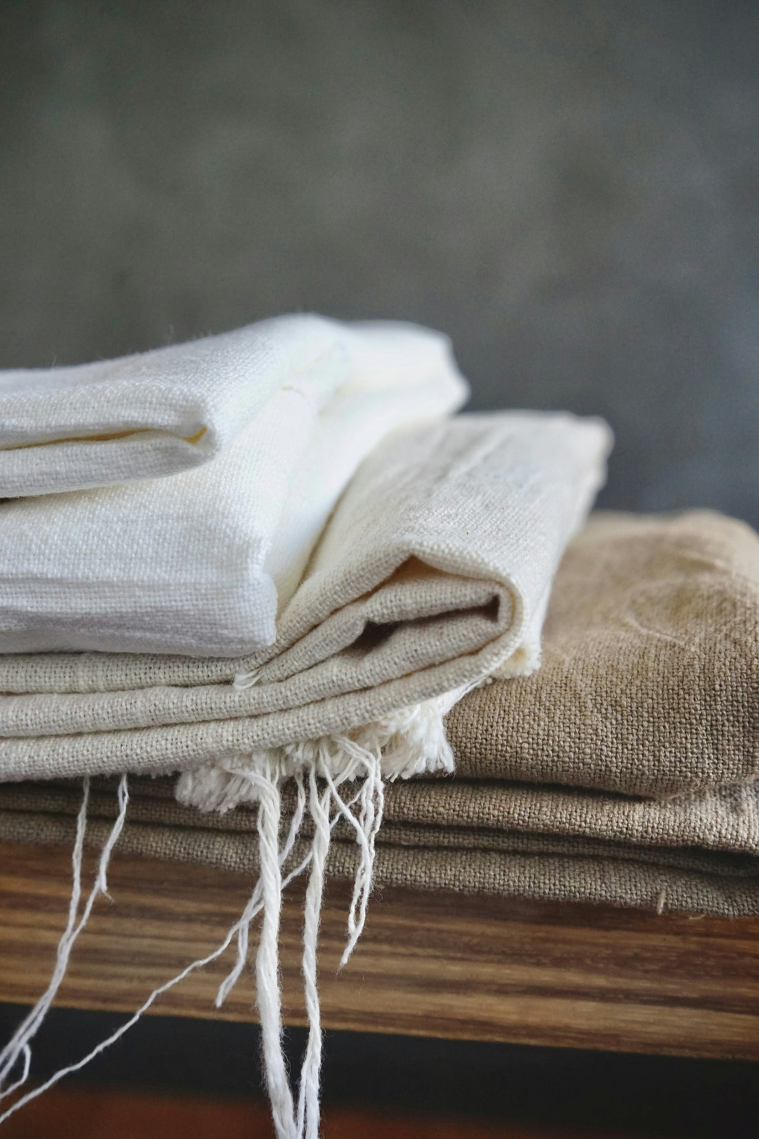 White fabric draped over wood — comparing Tencel and linen