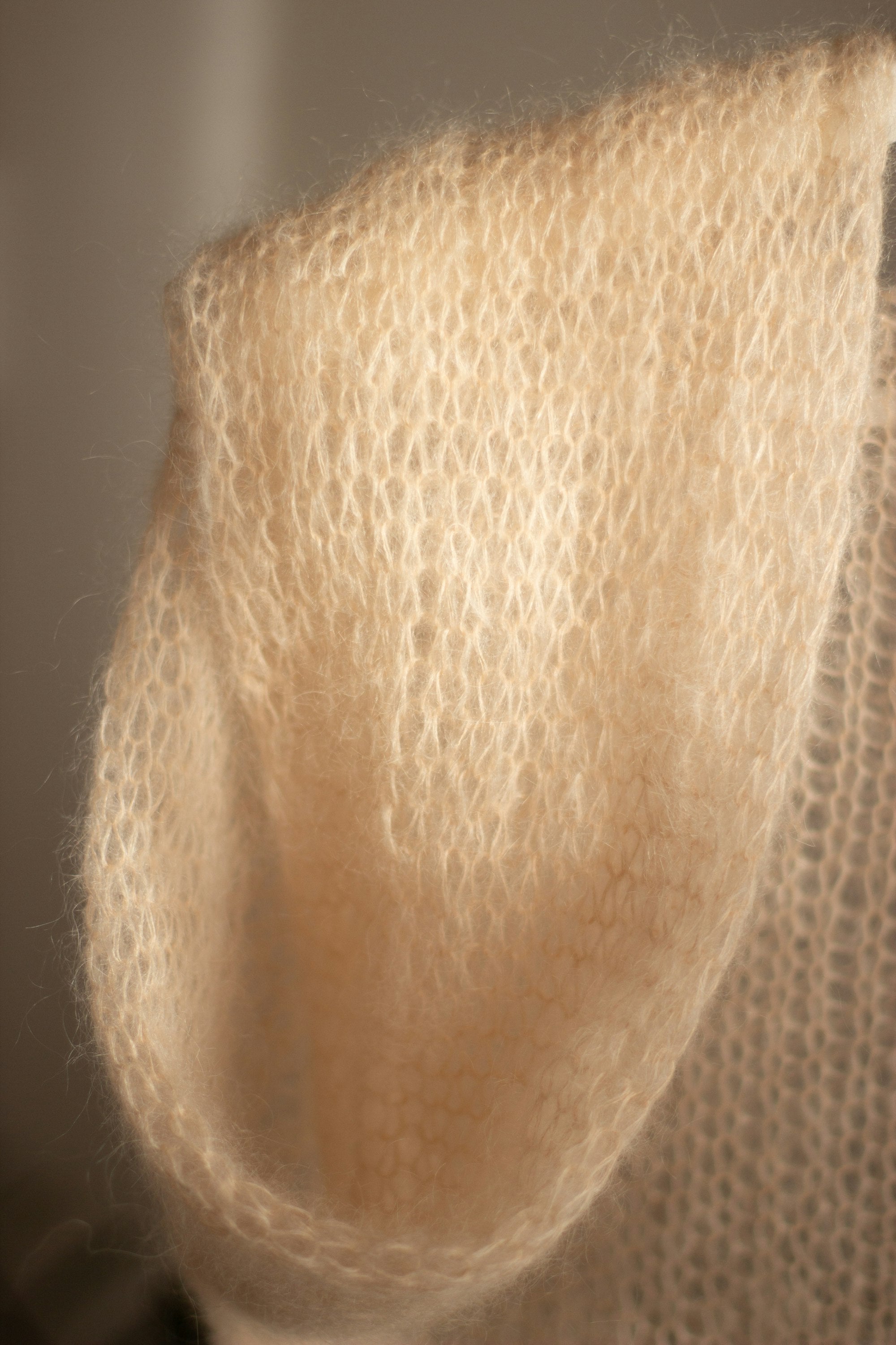 Close-up of delicate knit fabric — how to spot a quality sweater